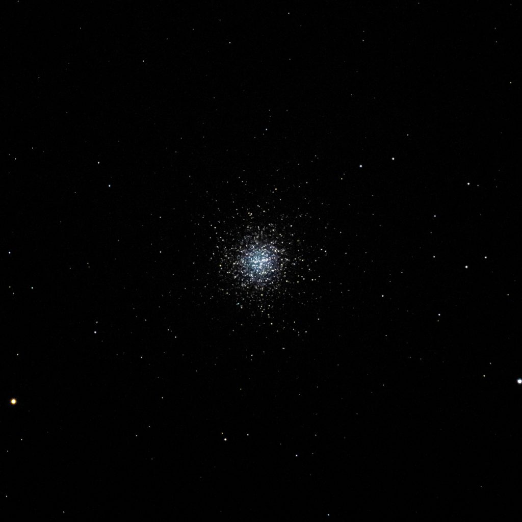  The luminous stars of globular cluster M13 shine their brilliant blues and yellows during a warm summer evening in Enid, Oklahoma. This cluster has stars that vary in color. This is why this formation is so enticing.