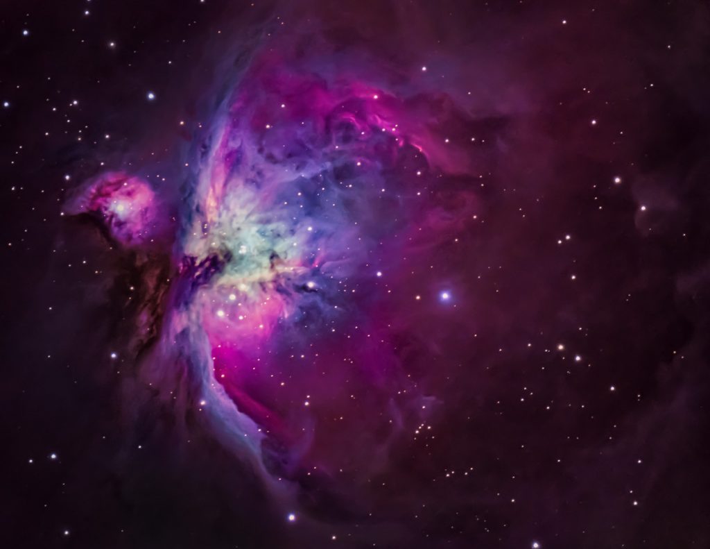 Vibrant colors radiate from the Orion Nebula on a crisp evening in Enid, Oklahoma. This photograph is a grouping of 17 images stacked together to capture the most detail possible.