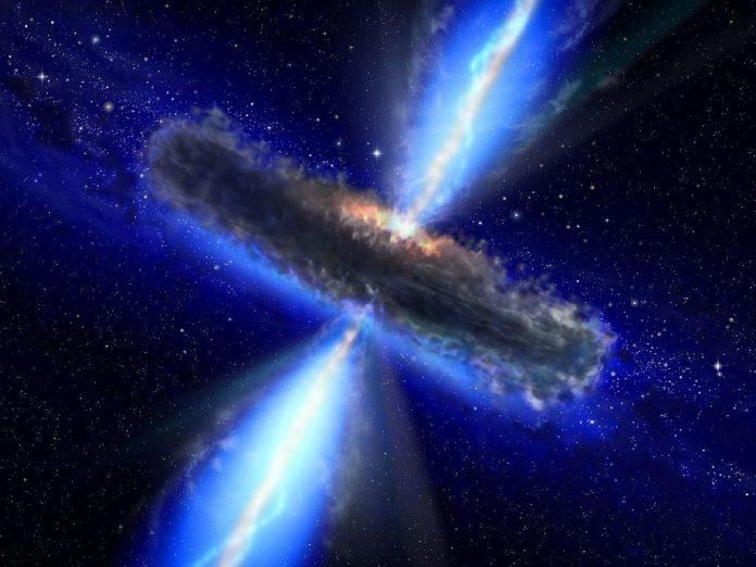 An artist rendering of a quasar with plasma juets streaming from the supermassive black hole at the galactic core/nucleus. Photo by NASA/ESA